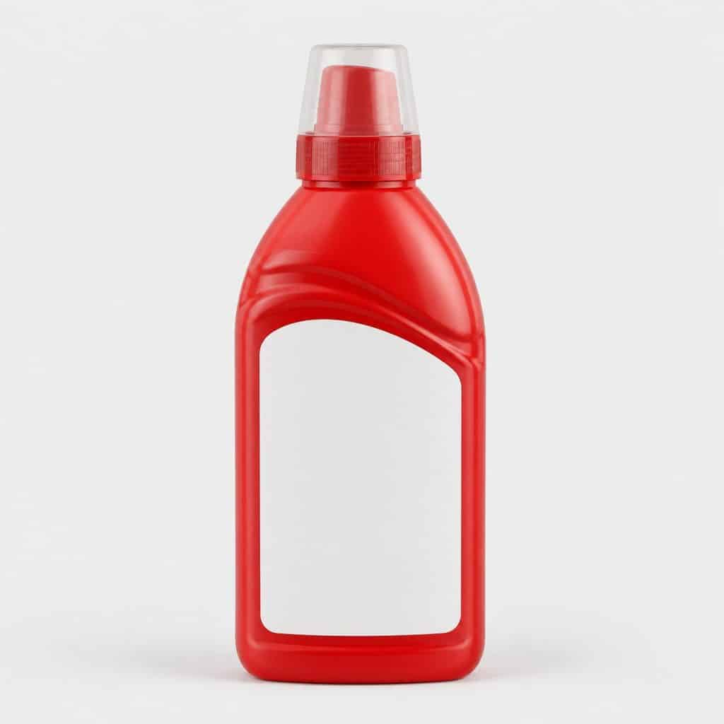 Flacon rouge d'additif nettoyant pour moteur essence